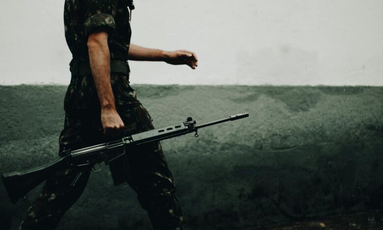 Armed military personnel in tactical gear during combat operations