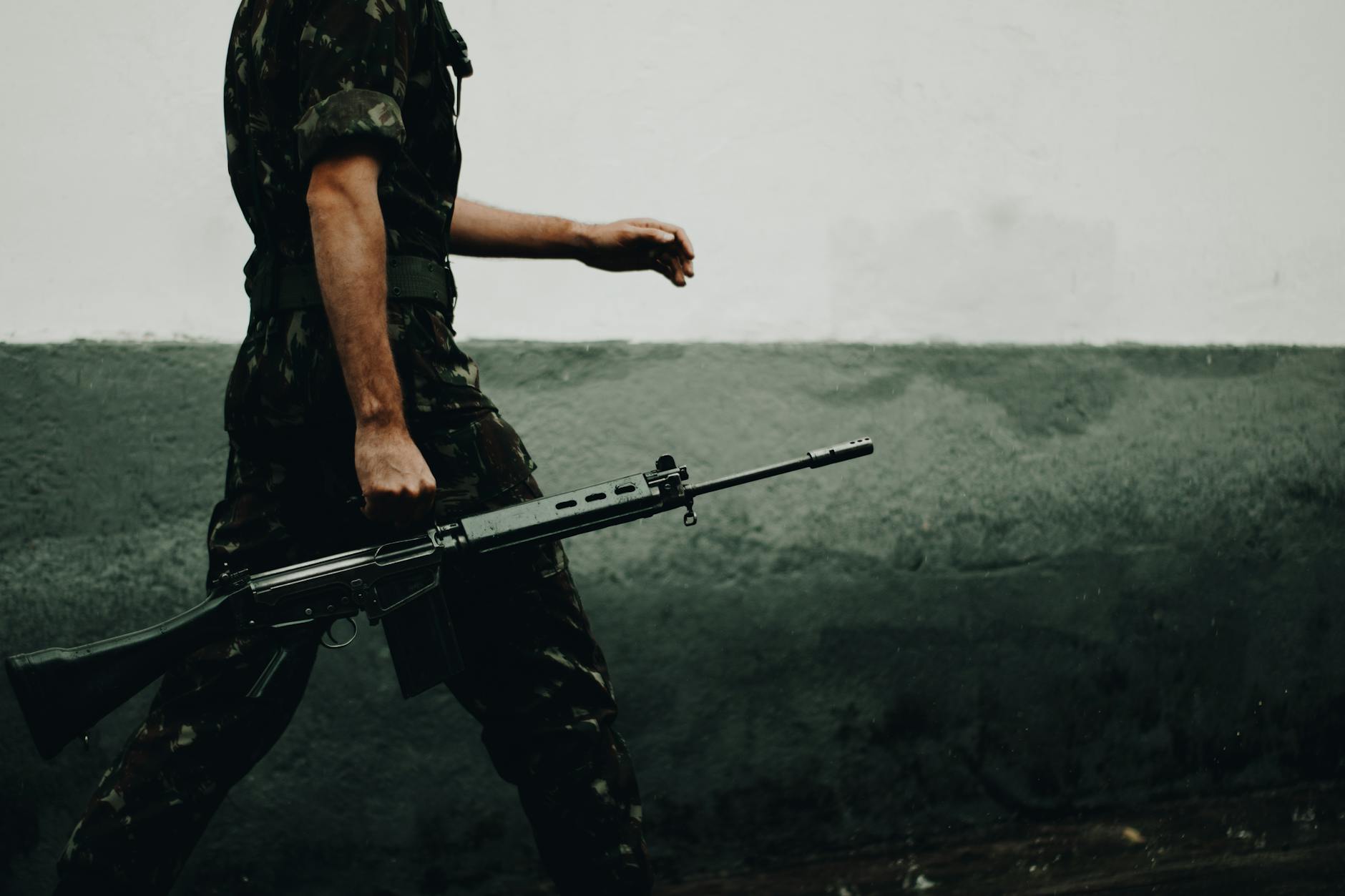 Armed military personnel in tactical gear during combat operations