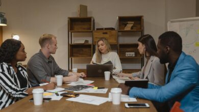 Business professionals discussing strategy in modern conference room