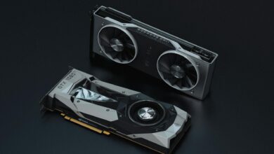 Modern graphics card installed in gaming computer showing RGB lighting and cooling fans
