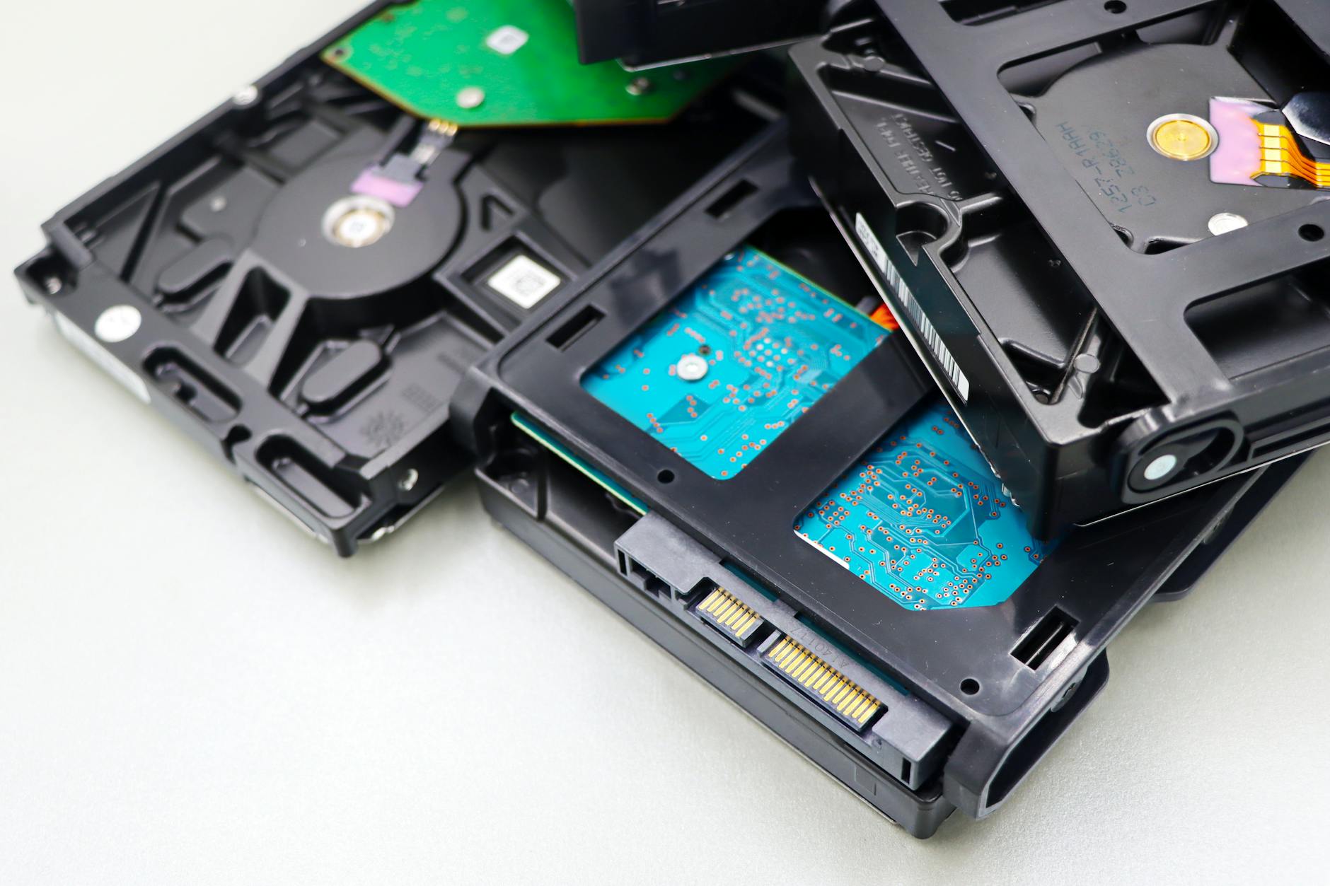 Various computer storage drives and components arranged on a desk