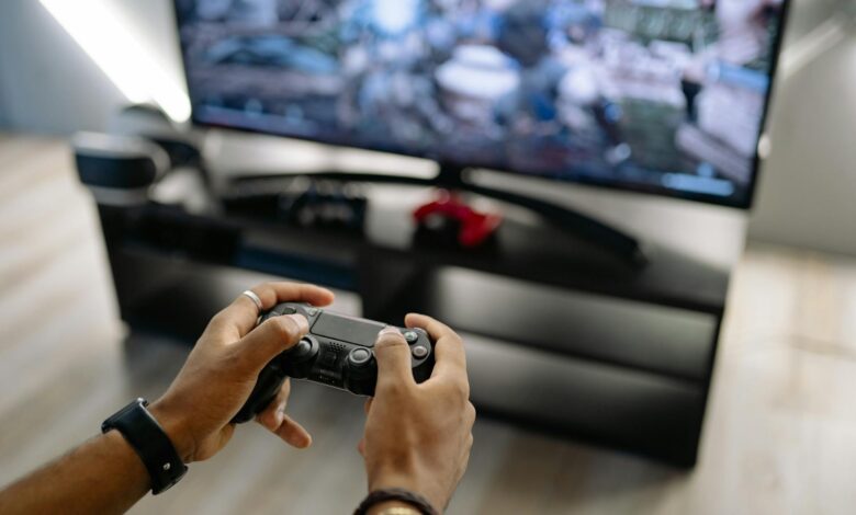 Modern handheld gaming device on wooden surface