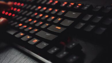 Close-up of mechanical gaming keyboard with RGB backlighting on desk