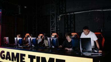 Esports tournament setup with gaming monitors and competitive arena lighting