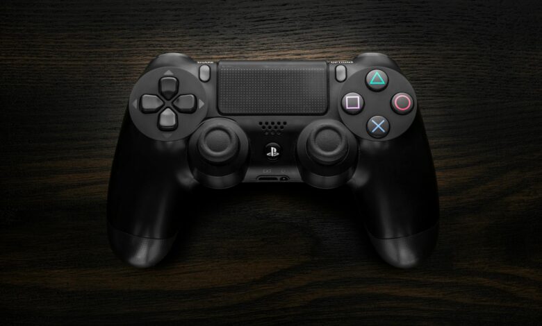 Modern gaming controller on dark surface representing console gaming hardware