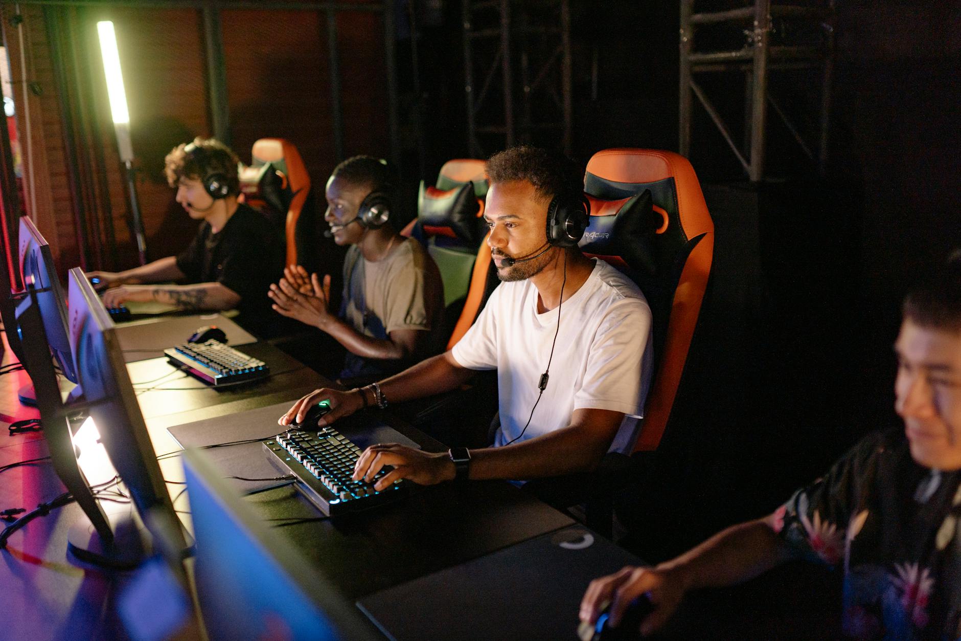 Professional gaming tournament setup with multiple screens and competitive gaming equipment