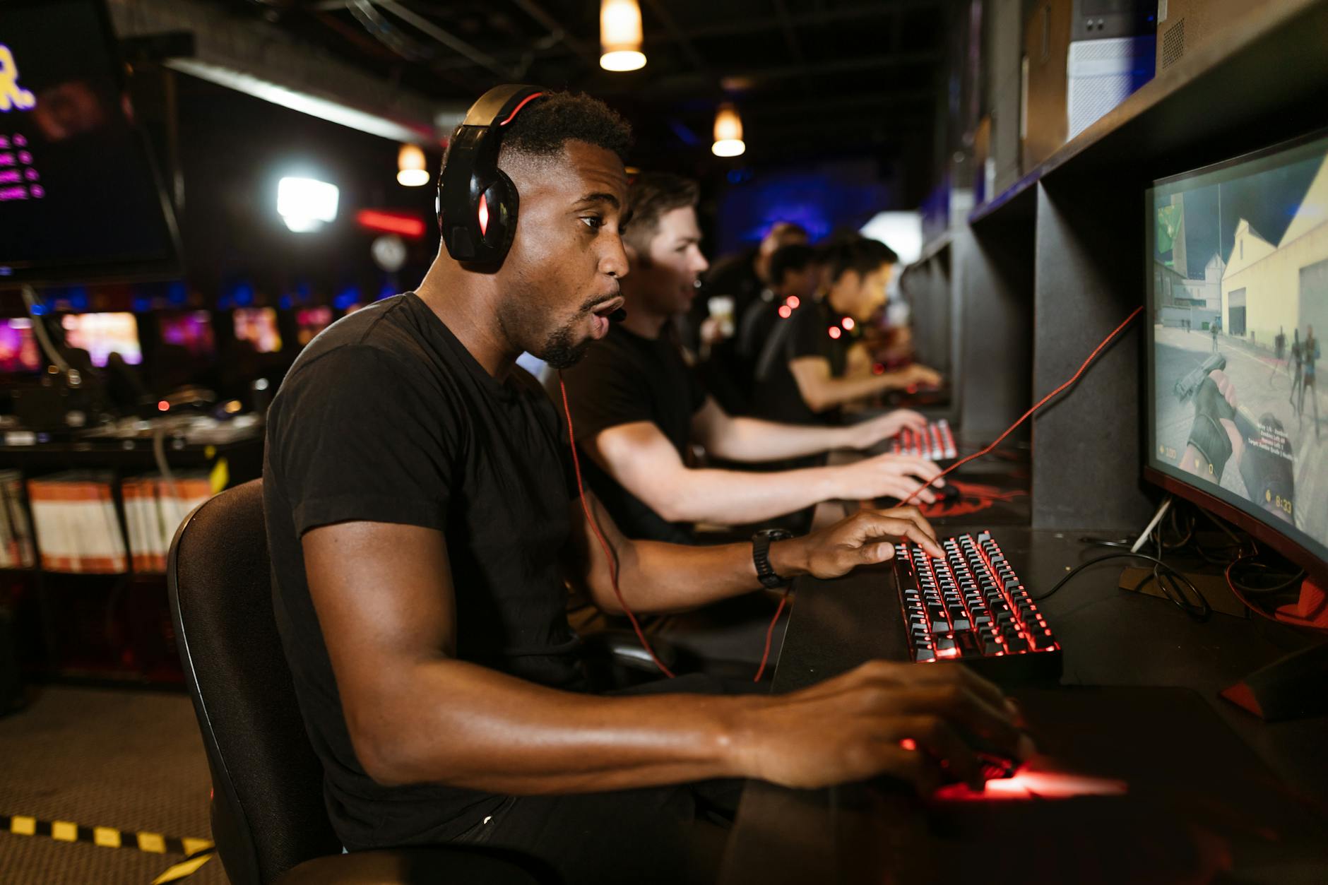 Professional esports tournament arena with gaming setups and stage lighting