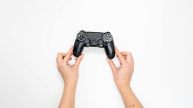 Hands holding a gaming controller during Street Fighter gameplay session