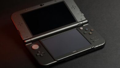 Close-up view of handheld gaming device screen showing vibrant game graphics