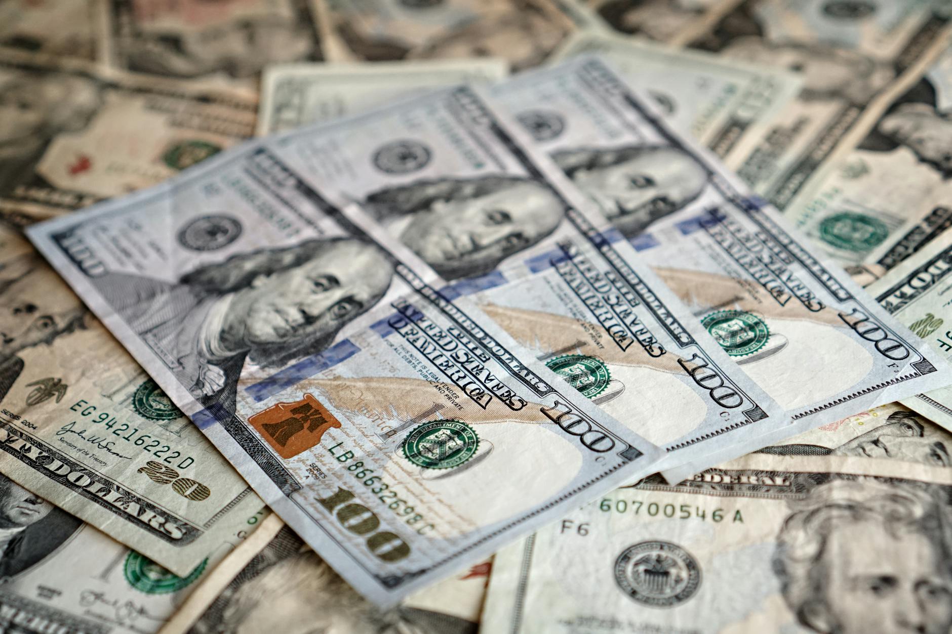 Stack of money bills representing prize pool funding and tournament economics