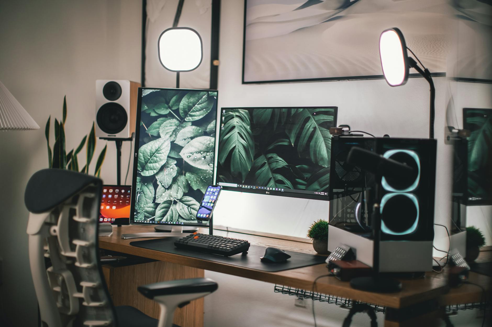 Modern streaming setup with multiple monitors, professional lighting, and gaming peripherals for content creation