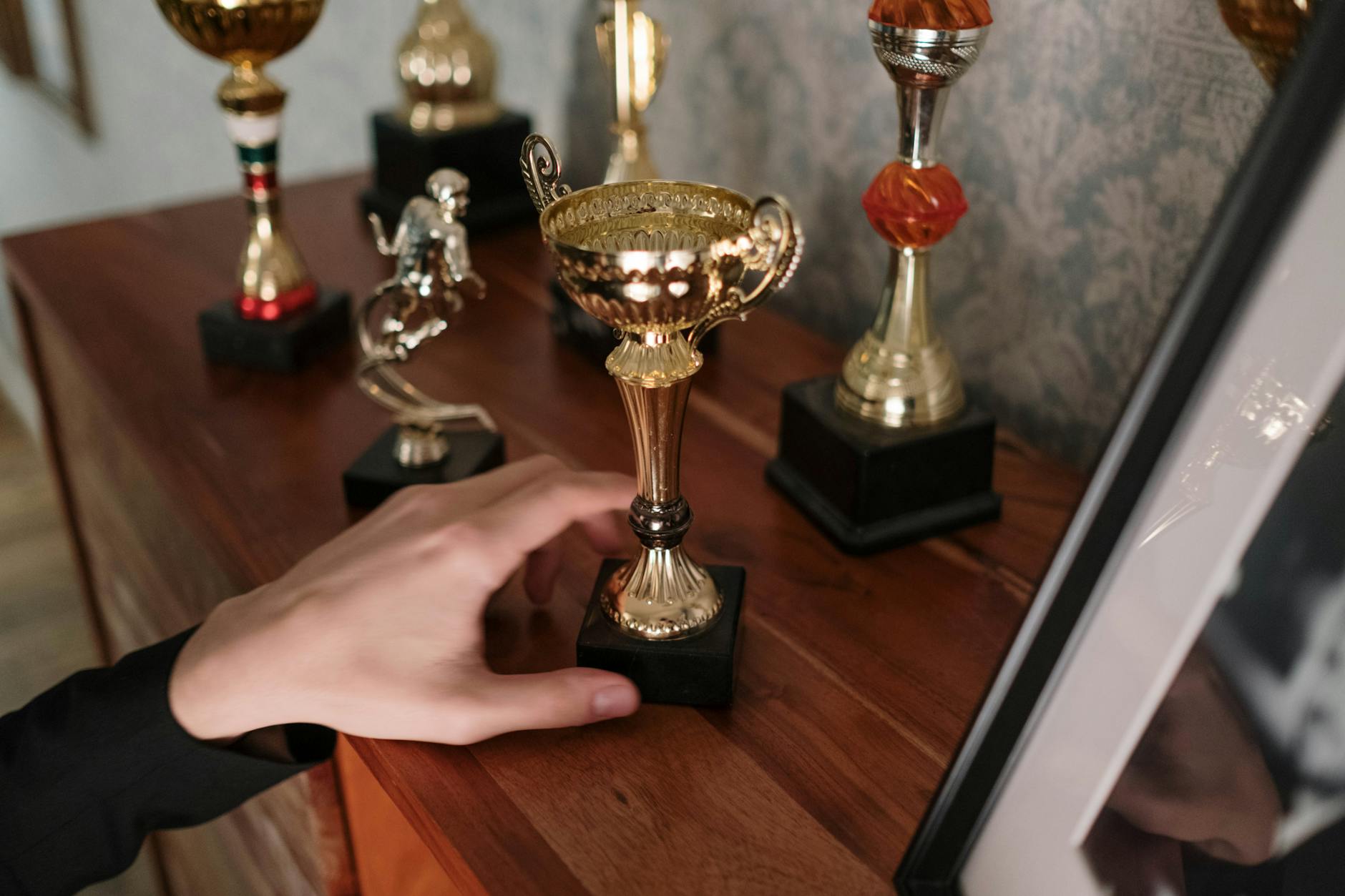 Golden trophy on podium representing competitive gaming achievement and prize distribution