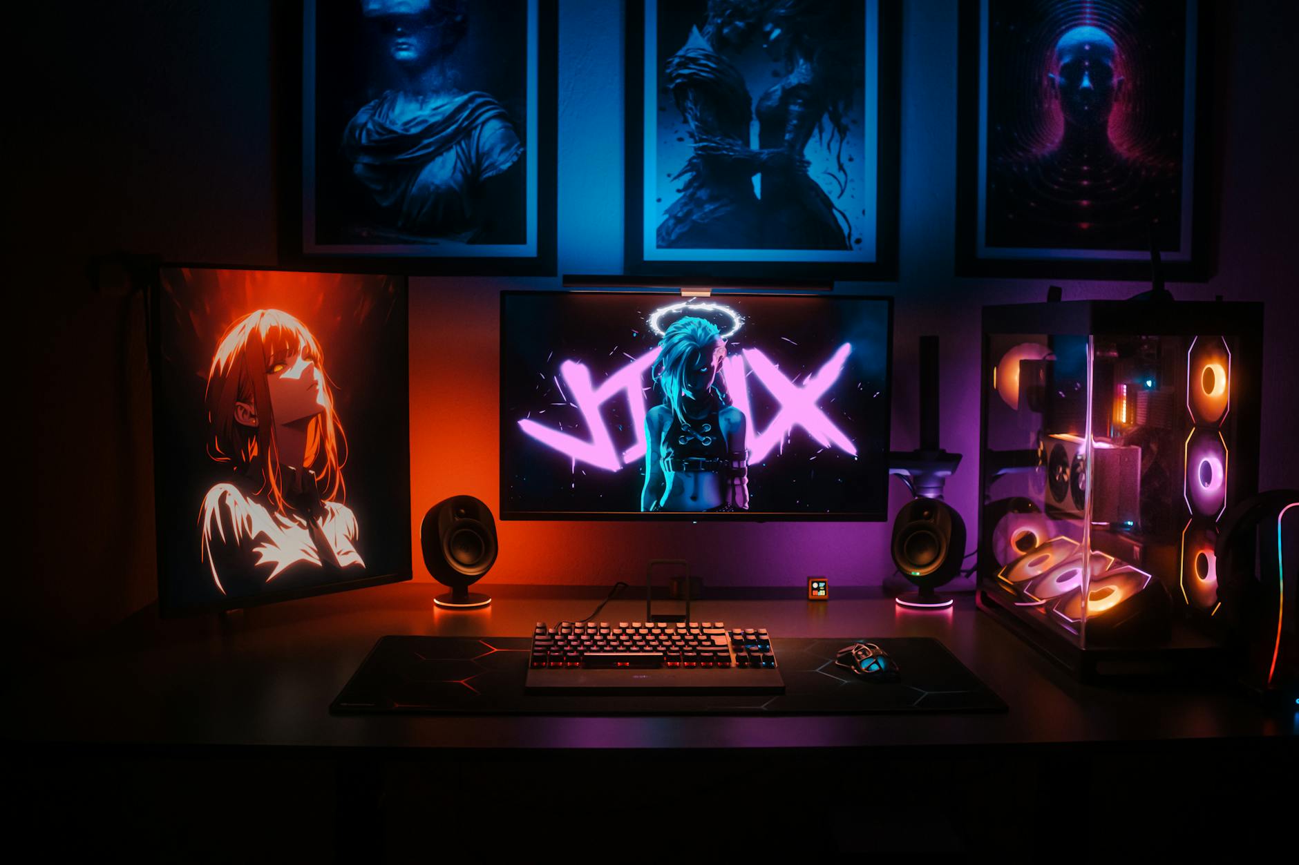 Modern gaming PC setup with RGB lighting and multiple monitors