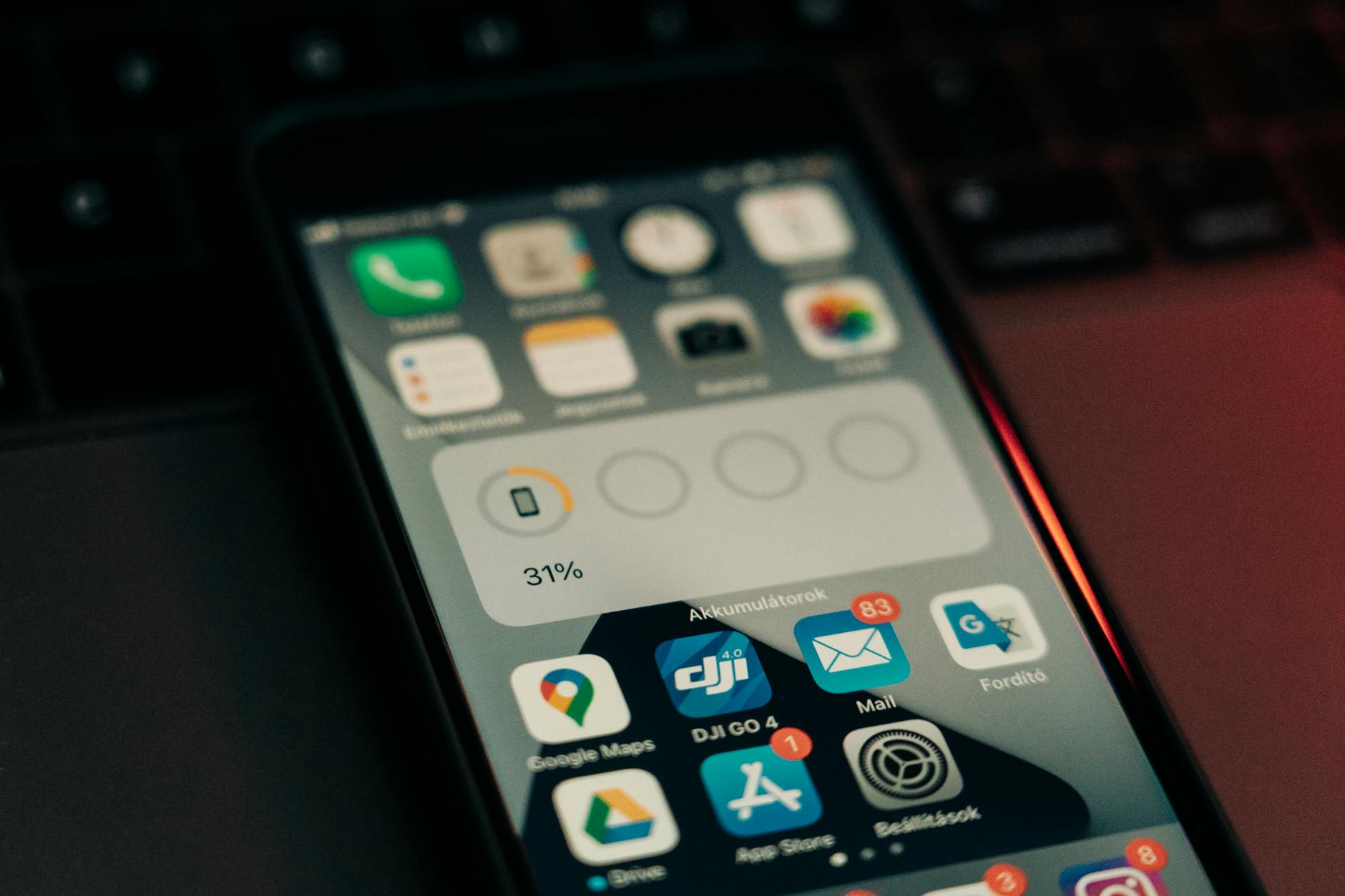 Developer working on mobile application code on computer screen