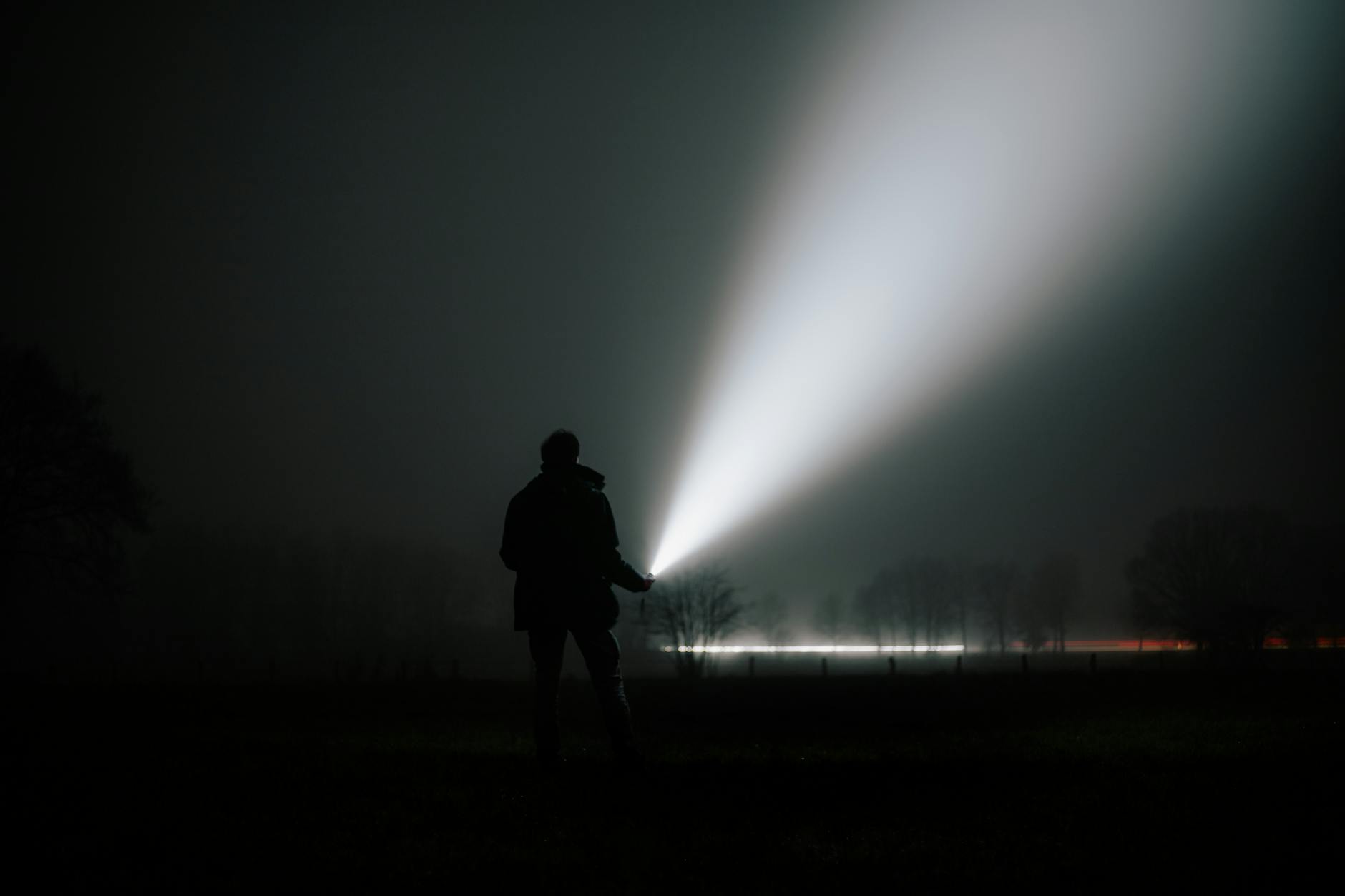 Flashlight illuminating dark corridor showing atmospheric horror game lighting