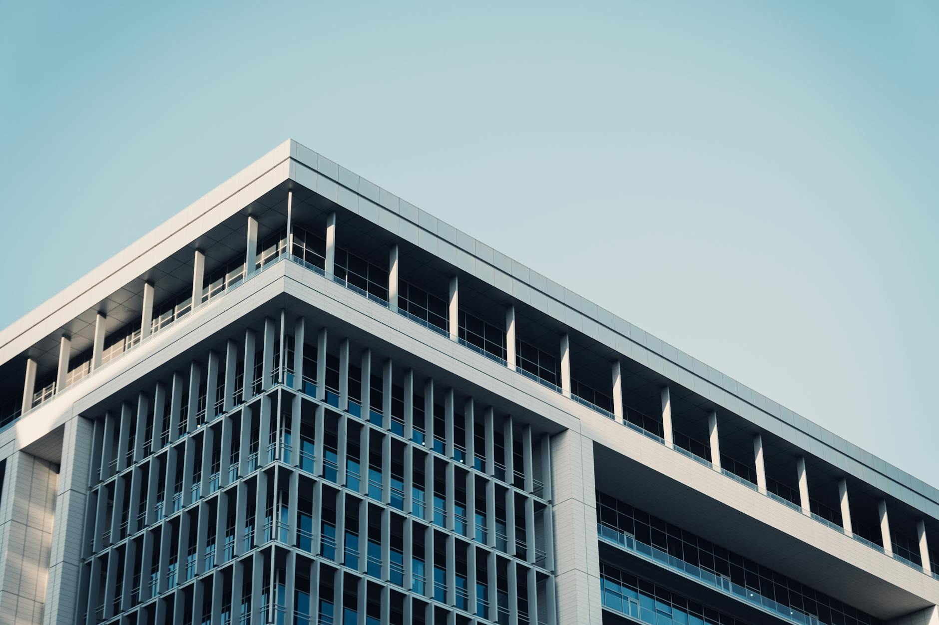 Modern office building exterior with glass windows and corporate architecture