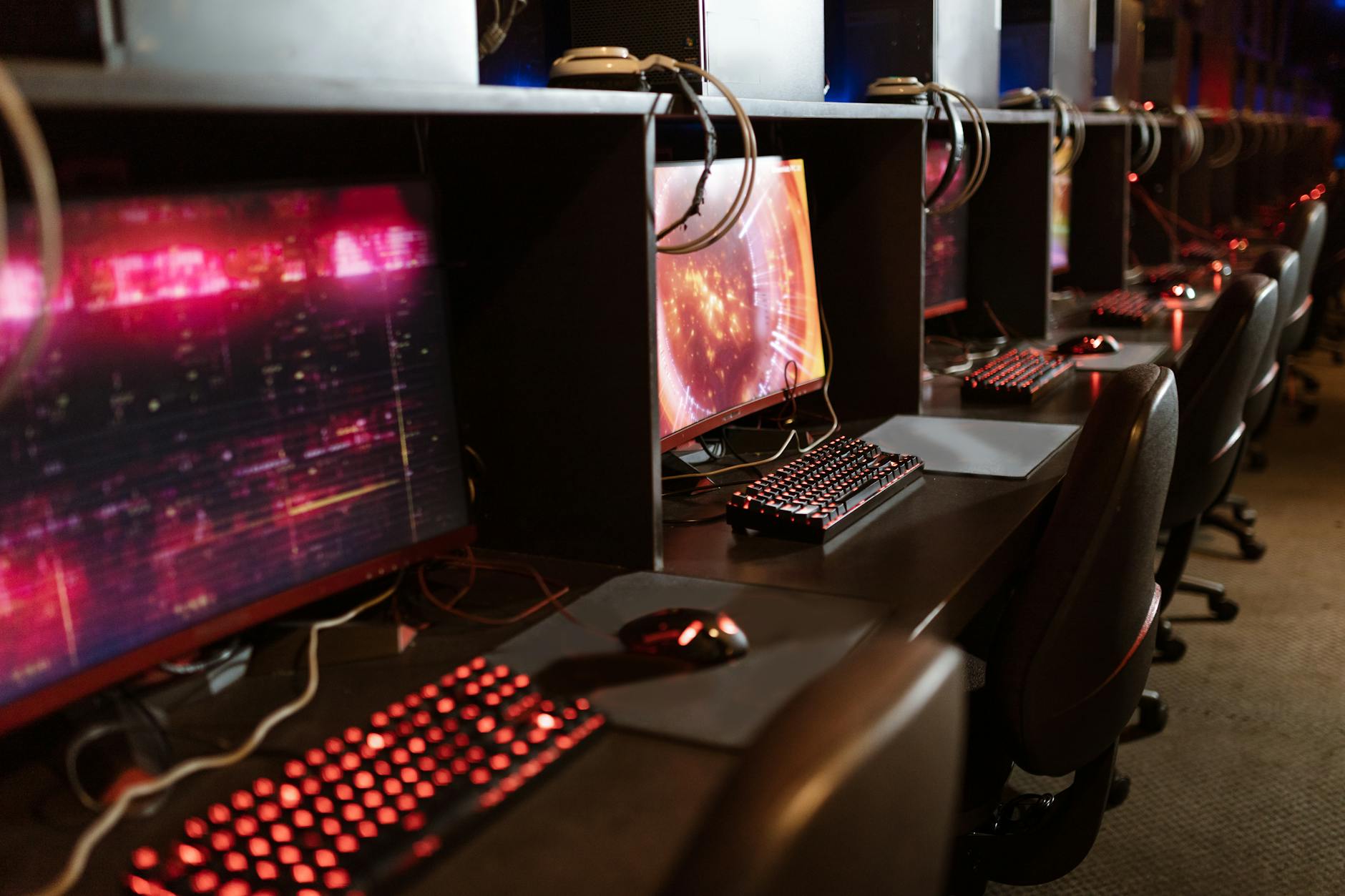 Gaming monitor displaying colorful game graphics with keyboard and mouse setup