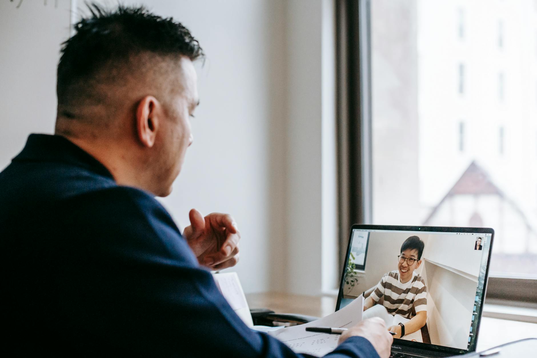 Remote team collaboration session showing multiple participants on video conference call