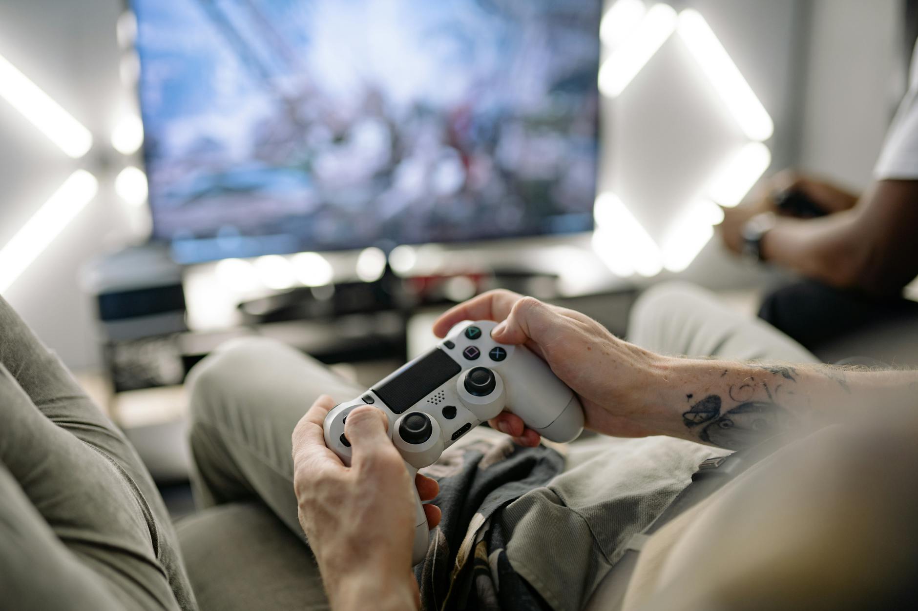 Modern gaming setup with large television display and console in entertainment center