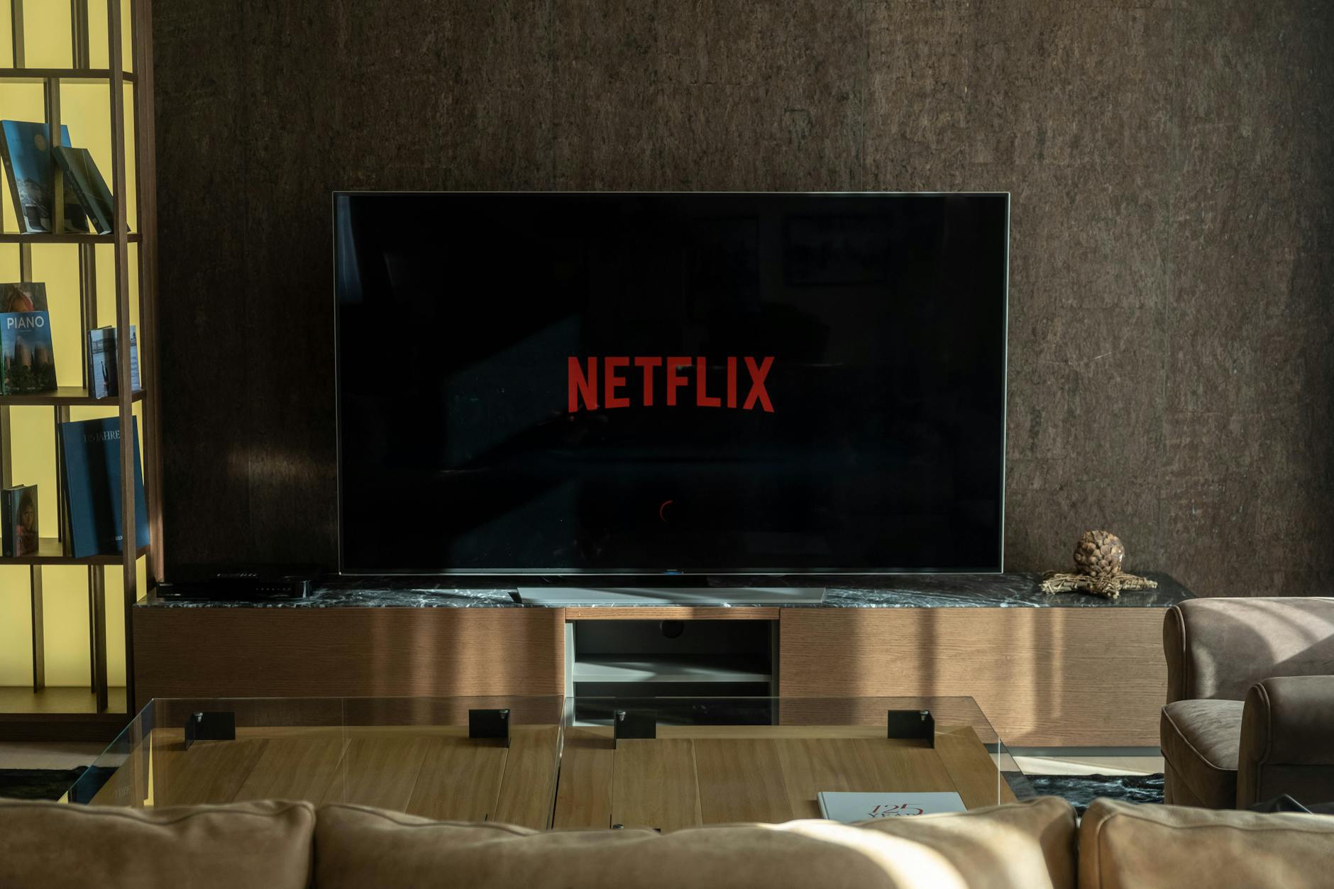Modern entertainment setup with gaming consoles and screens displaying gaming content