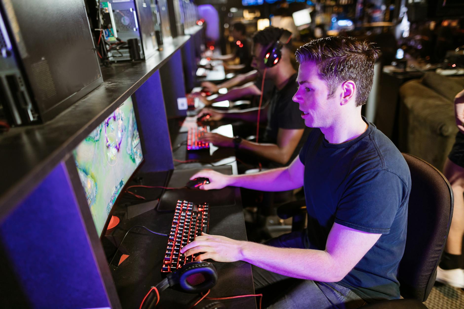 Modern gaming computer setup with RGB lighting and multiple monitors