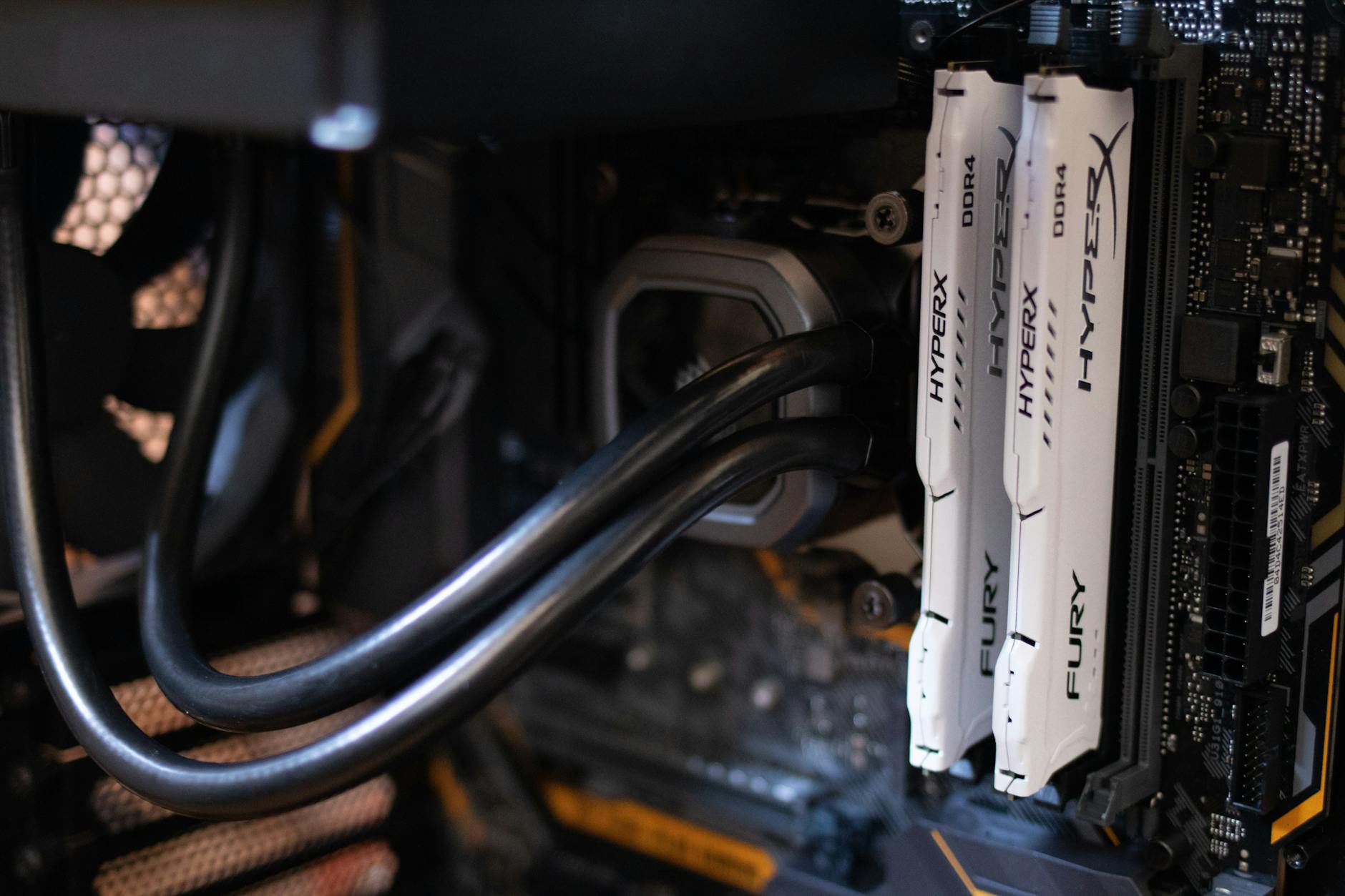 Close-up of a dual-tower CPU air cooler installed on a desktop PC motherboard