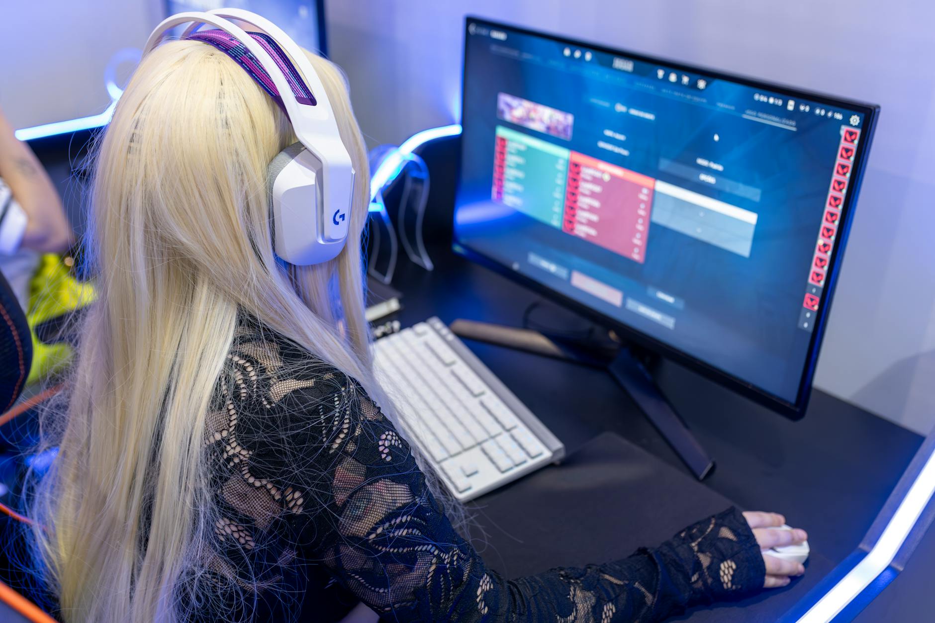 PC gaming setup with monitor, keyboard, and mouse on a desk