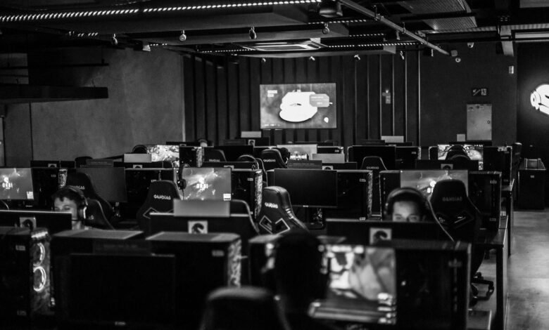 Players competing on stage at a large esports arena event