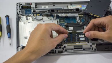 Two NVMe SSDs side by side on a motherboard surface for comparison