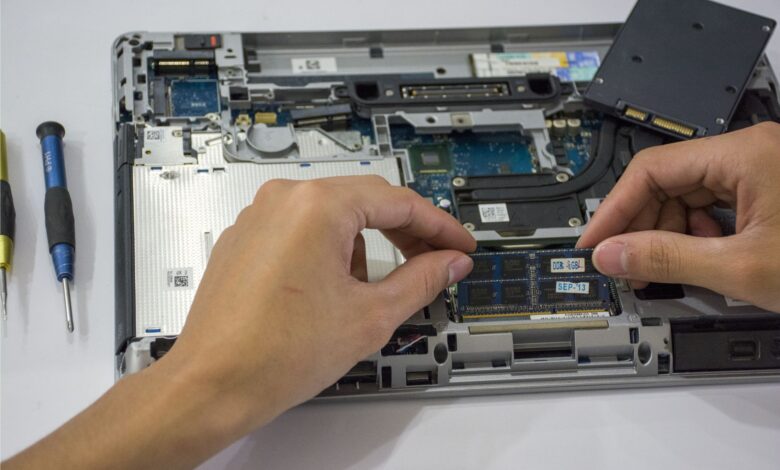 Two NVMe SSDs side by side on a motherboard surface for comparison
