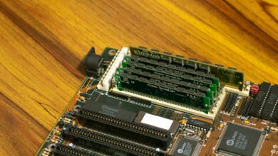 Two DDR5 memory kits installed in a high-end gaming PC motherboard