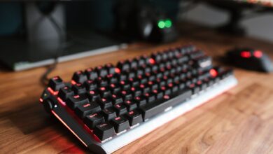 Premium mechanical keyboard on a gaming desk setup with RGB lighting