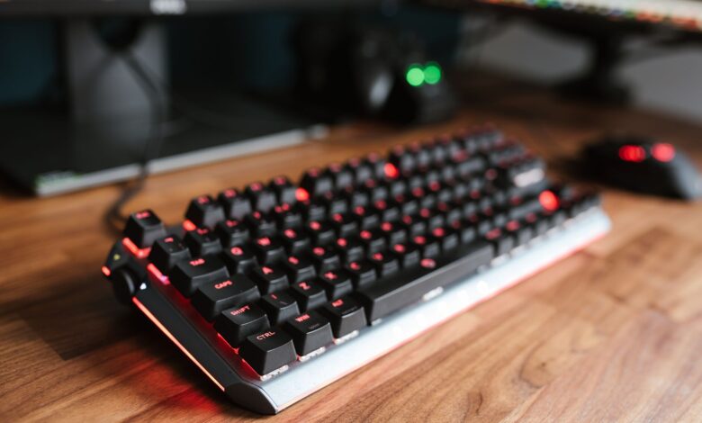 Premium mechanical keyboard on a gaming desk setup with RGB lighting