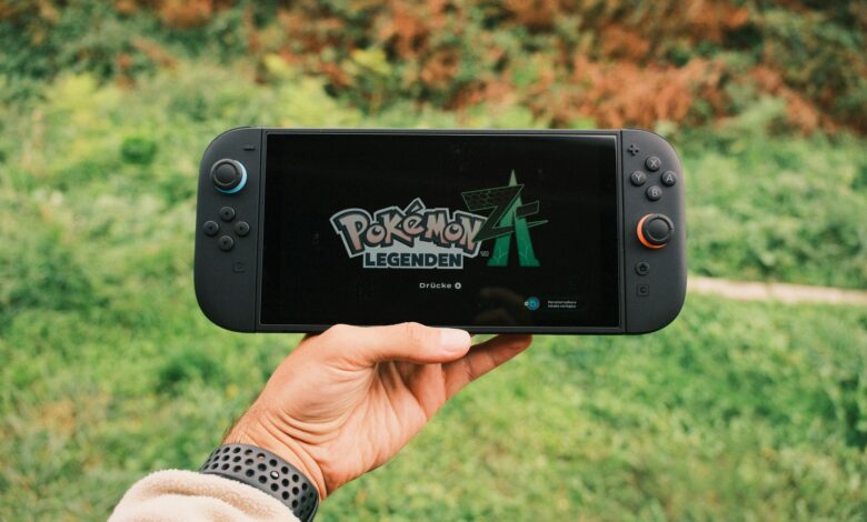 A handheld gaming PC device held in two hands during gameplay