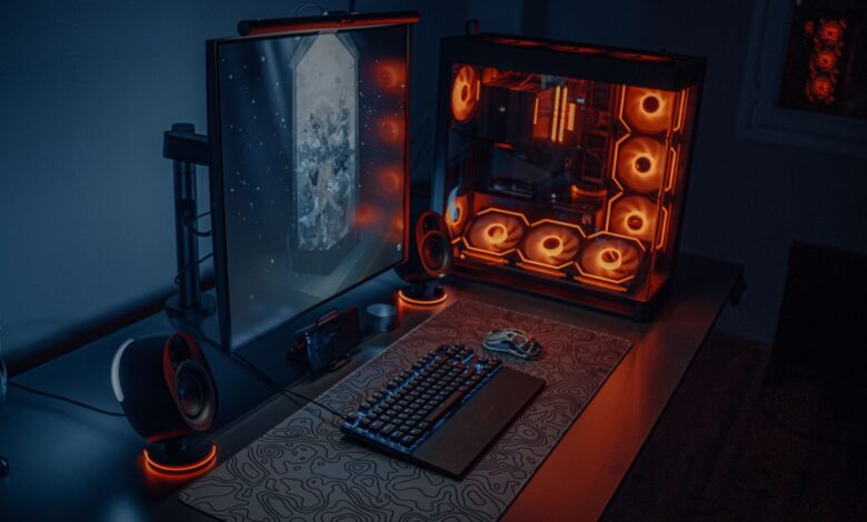 High-end gaming PC setup with RGB lighting and dual monitor display