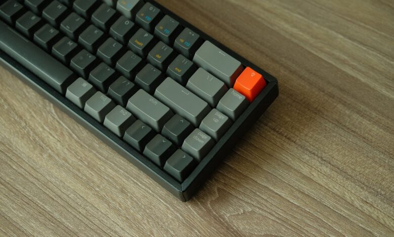 Close-up of a backlit mechanical gaming keyboard on a desk