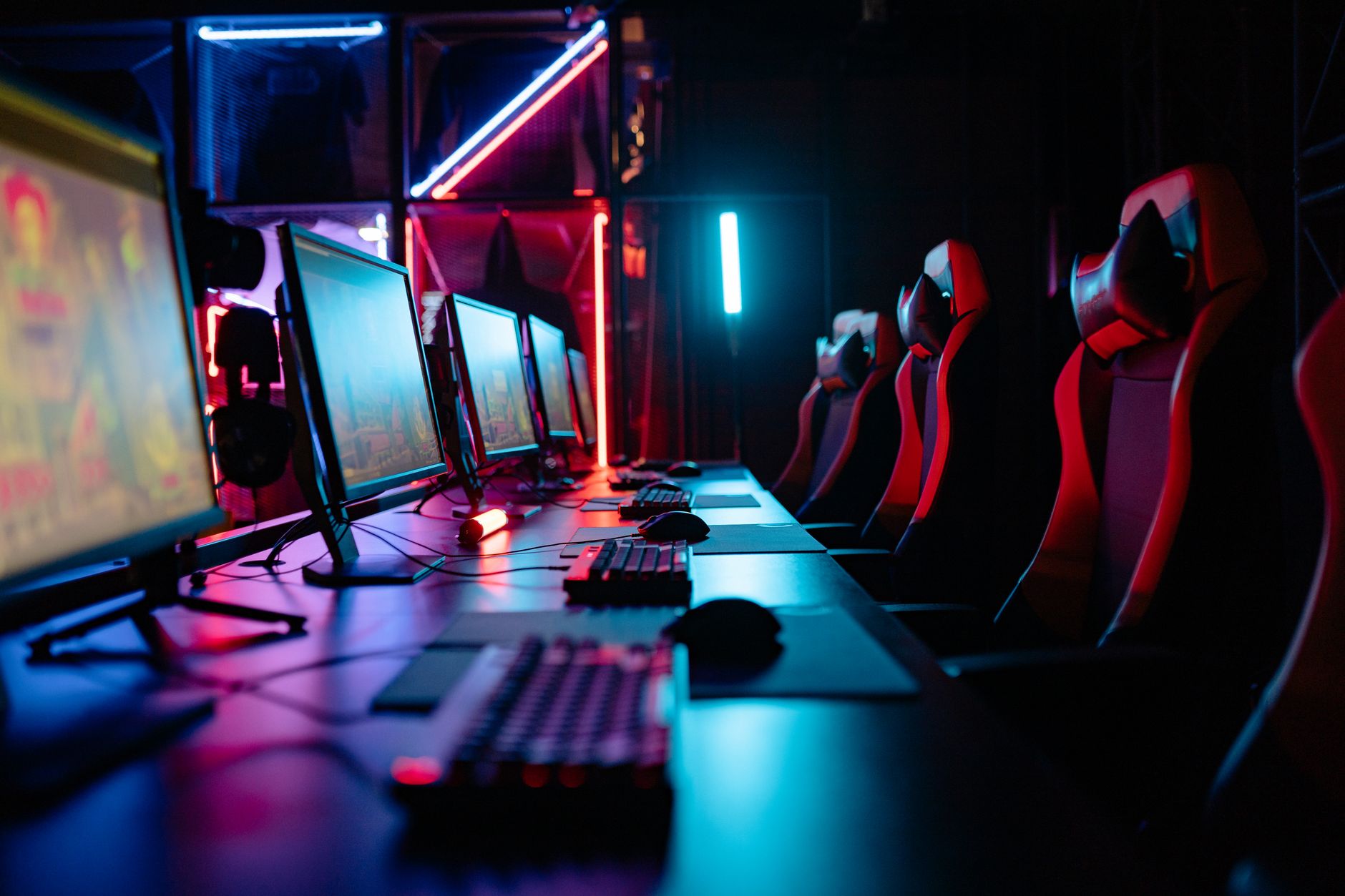 A gaming PC setup with monitor displaying a high-performance game at 1080p resolution