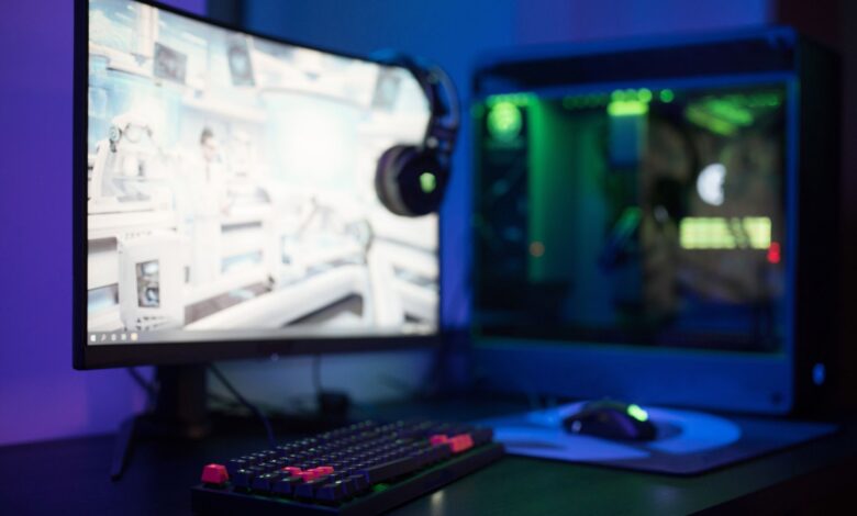 A high-end gaming PC setup with RGB lighting, representing mid-range GPU comparisons at 1440p
