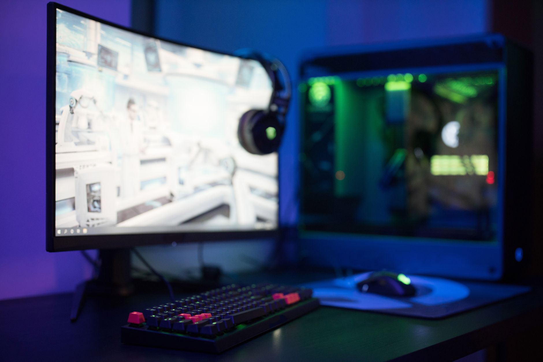 A high-performance gaming PC setup with RGB lighting, representing mid-range GPU comparisons