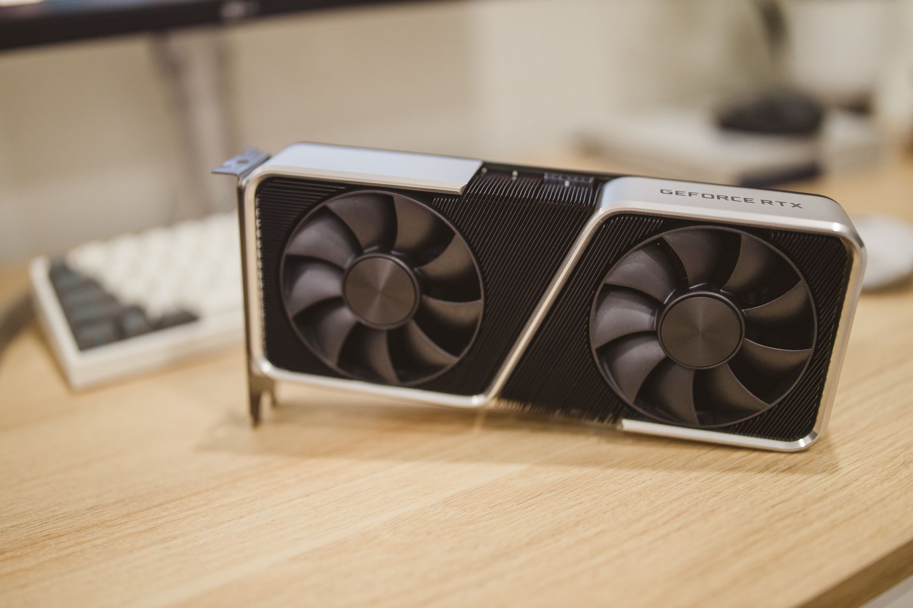 Close-up of a modern discrete graphics card showing cooling fans and heatsink