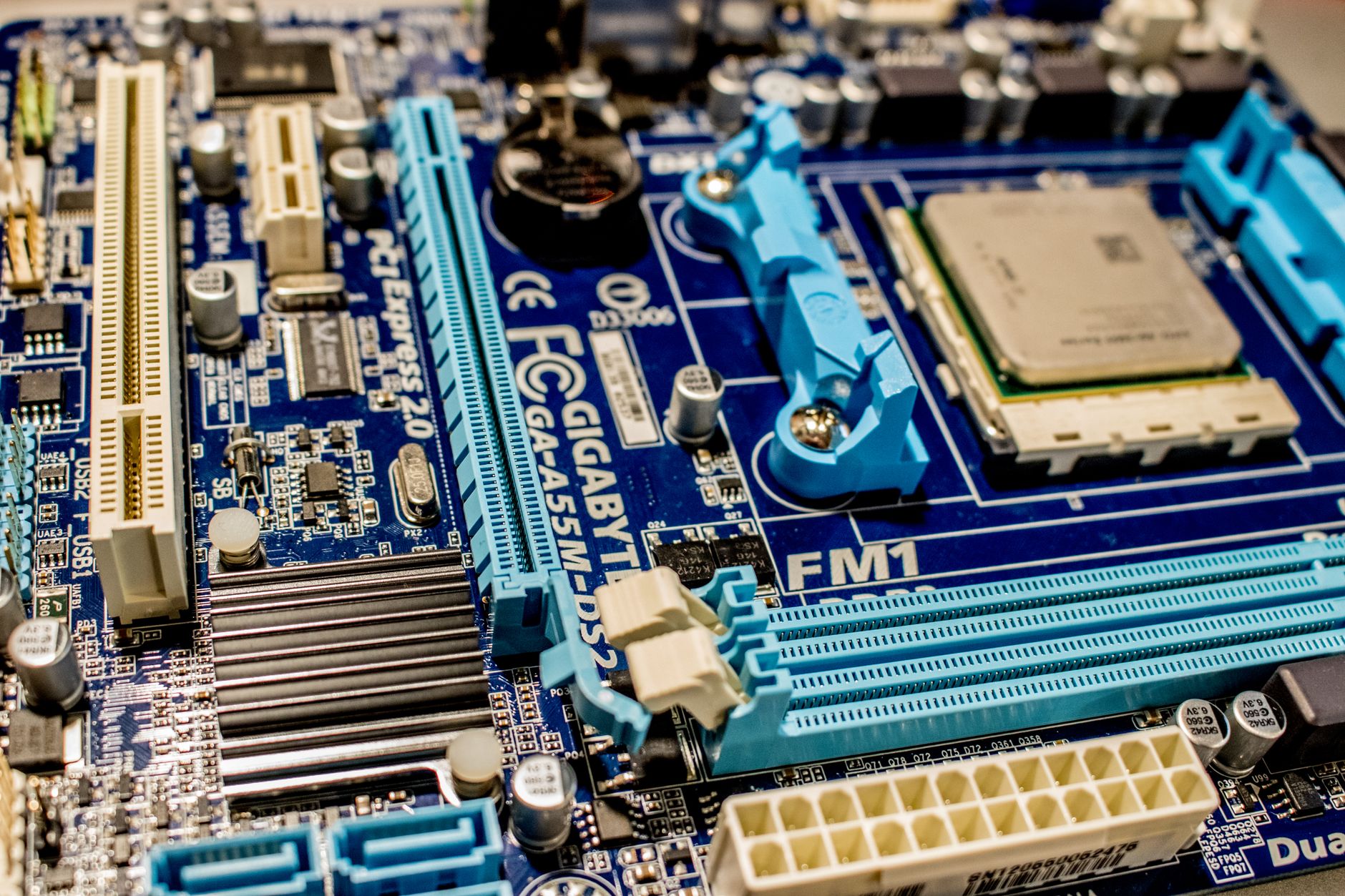 PC components laid out on a desk including a graphics card and motherboard